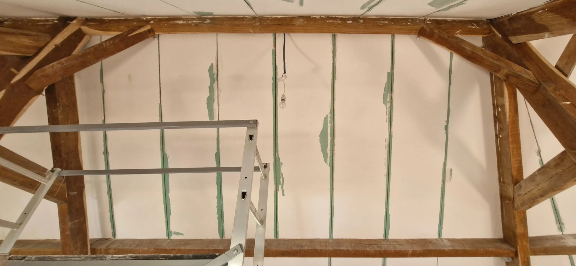 Ceiling and wall joints reinforced and filled during the repair process