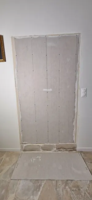 Plasterboard fitted over the new framework